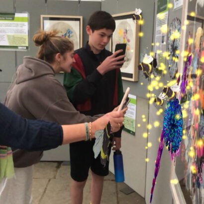 People looking at Alex Hirtzel AR paintings