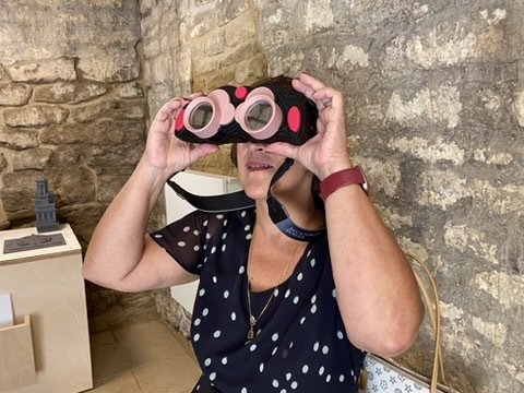 Woman looking through AR binoculars for Beckford's Tower, 360 degrees, AR landmark labels, Beckford's Tower, AR for heritage, AR for museums, Zubr, AR trail, AR app, AR tower viewer, VR tower viewer