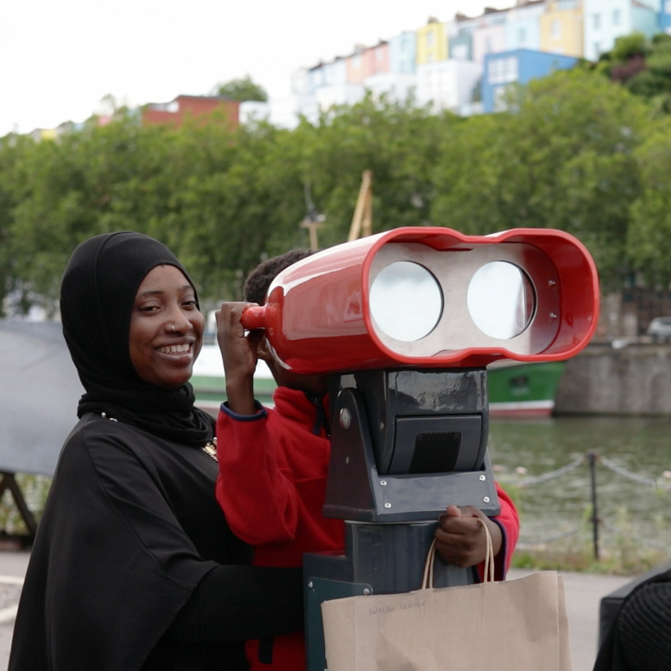 Mother and kid using VR binoculars at the SSGB.SS Great Britain celebrates 180 birthday with VR binoculars