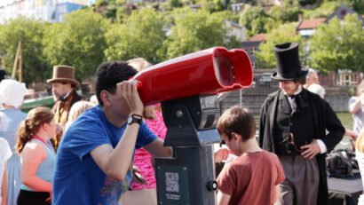 Person looking through SSGB AR binoculars