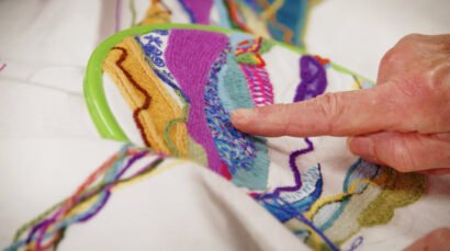 Handmade stitching the spirit heads tapestry, Zubr Highland digital project AR, High life Highland, digital tapestry