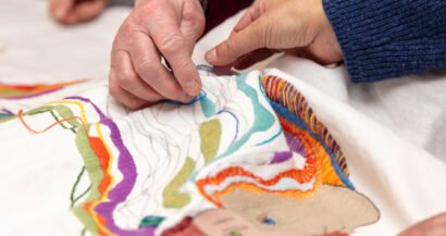 Handmade stitching the spirit heads tapestry, Zubr Highland digital project AR, High life Highland, digital tapestry