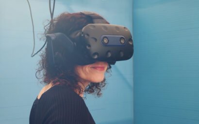 Woman wearing a VR headset. Afloat and Ashore project. Tide. Zubr's expertise in VR