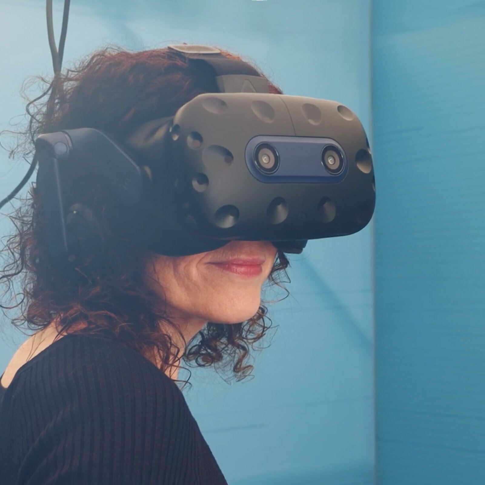 Woman wearing a VR headset. Afloat and Ashore project. Tide. Zubr's expertise in VR