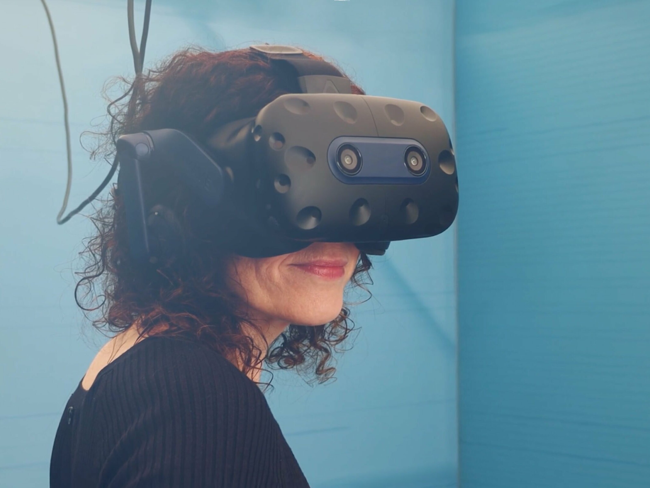 Woman wearing a VR headset. Afloat and Ashore project. Tide. Zubr's expertise in VR