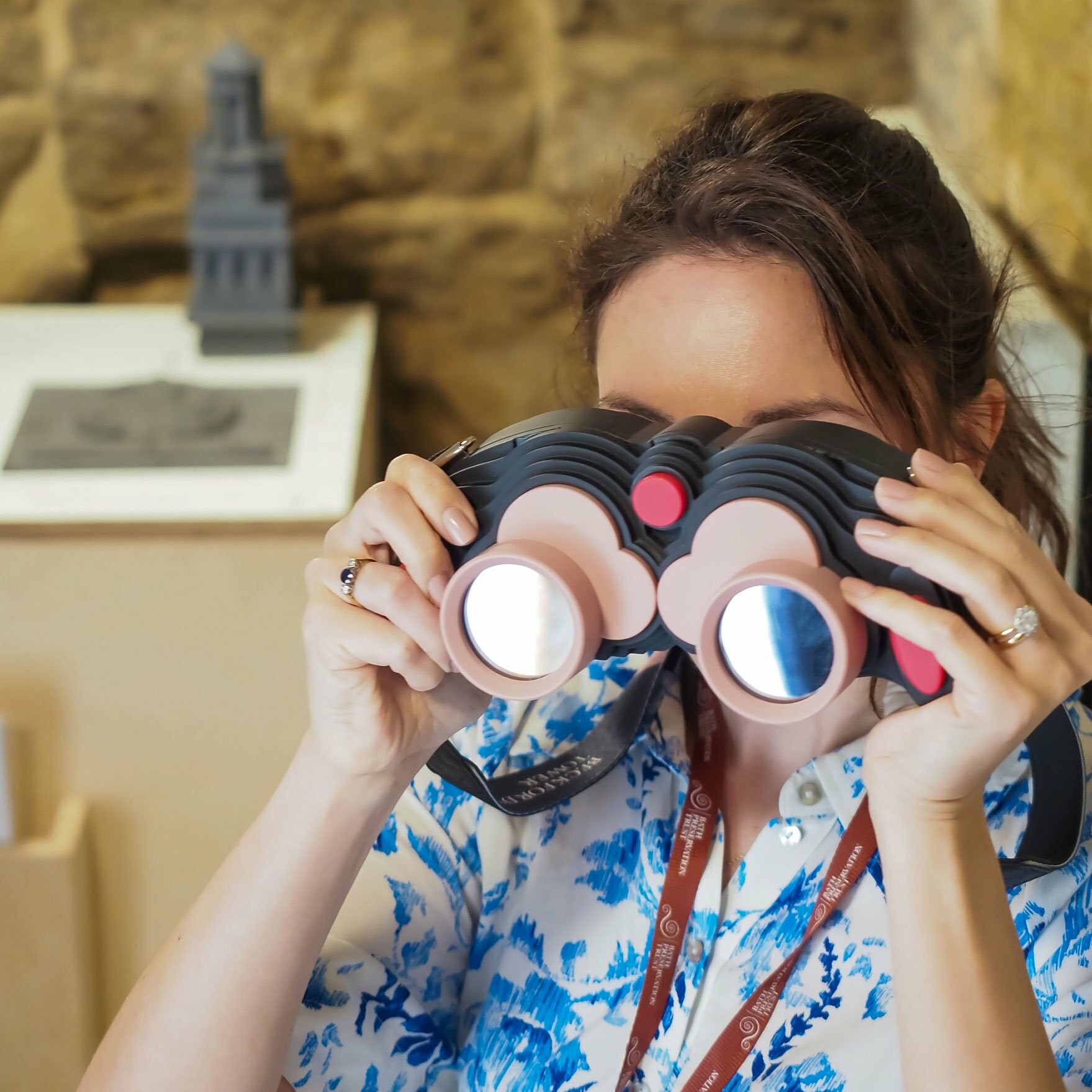 Woman looking through AR binoculars for Beckford's Tower, 360 degrees, AR landmark labels, Beckford's Tower, AR for heritage, AR for museums, Zubr, AR trail, AR app, AR tower viewer, VR tower viewer. Bath AR Trail