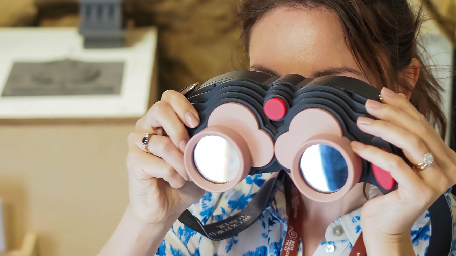 Woman looking through AR binoculars for Beckford's Tower, 360 degrees, AR landmark labels, Beckford's Tower, AR for heritage, AR for museums, Zubr, AR trail, AR app, AR tower viewer, VR tower viewer. Bath AR Trail