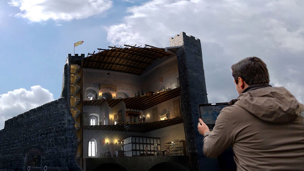 Person holding iPad testing CGI immersive AR heritage site reconstruction app for Carrickfergus Castle, Tourism Northern Ireland