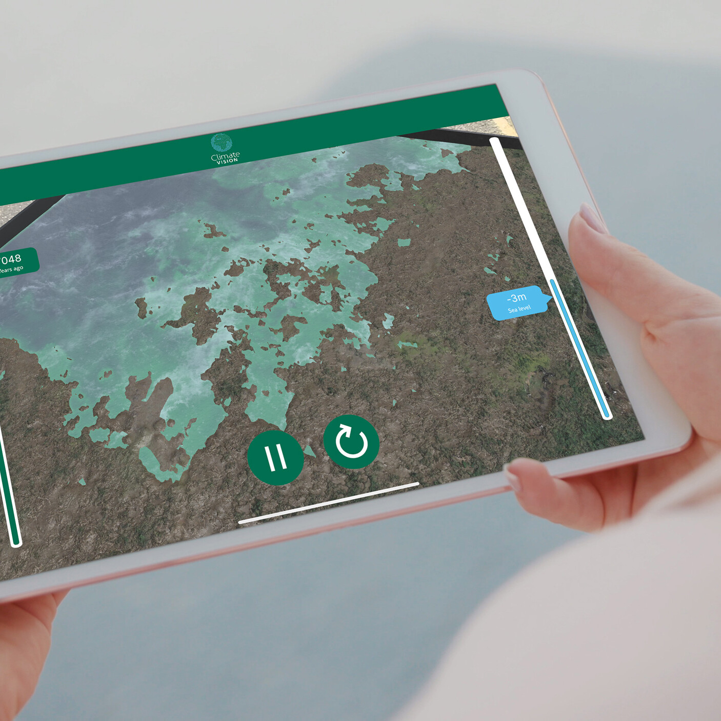 Person holding tablet visualising Augmented reality app that showcases 3d model terrain flooding. Climate change AR app