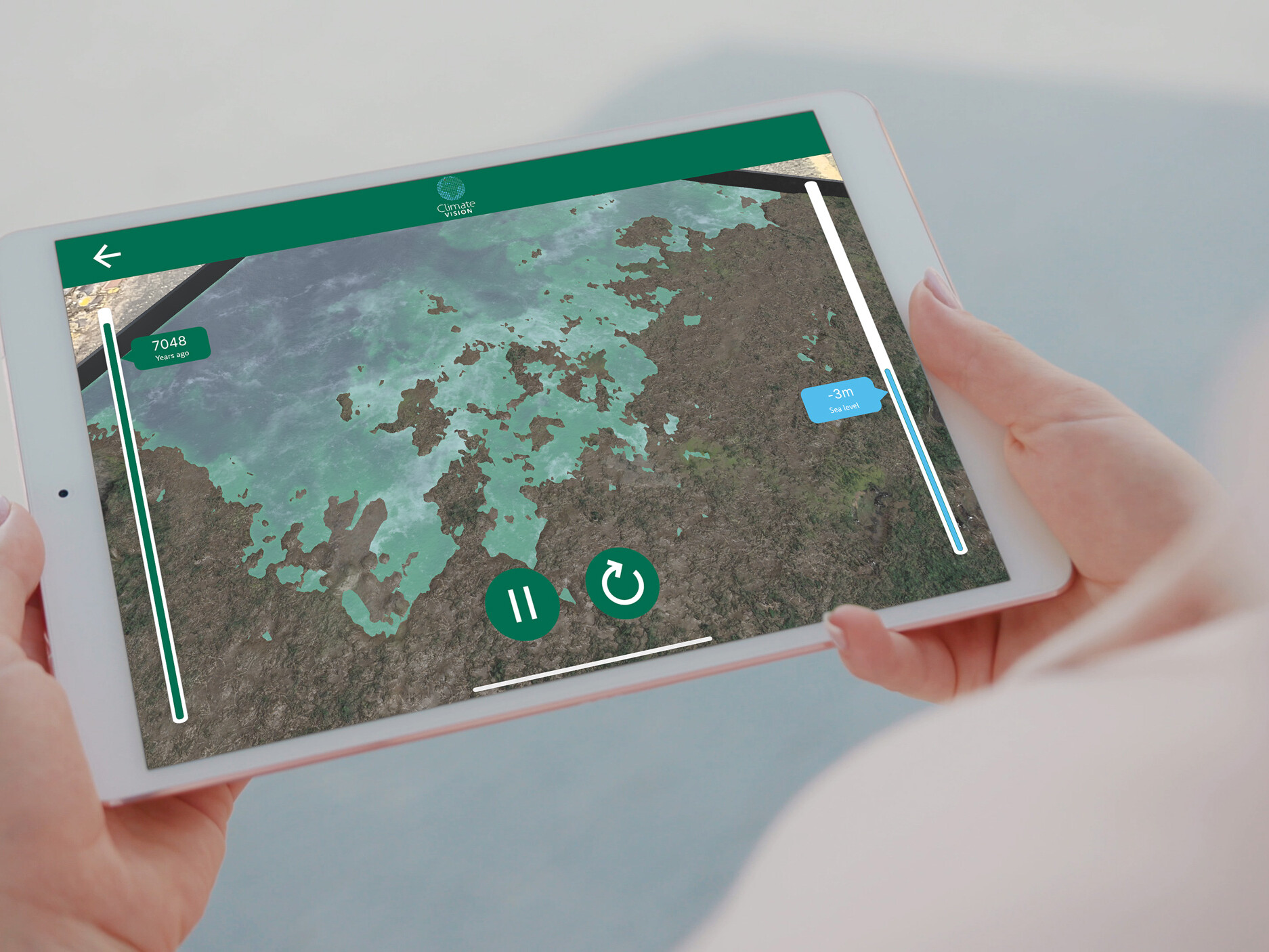 Person holding tablet visualising Augmented reality app that showcases 3d model terrain flooding. Climate change AR app