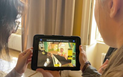 Two students holding ipad using the Making a Scene app, an AR theatre careers app for a mixed reality educational loan box for University of Bristol Theatre Collection and Bristol Old Vic.