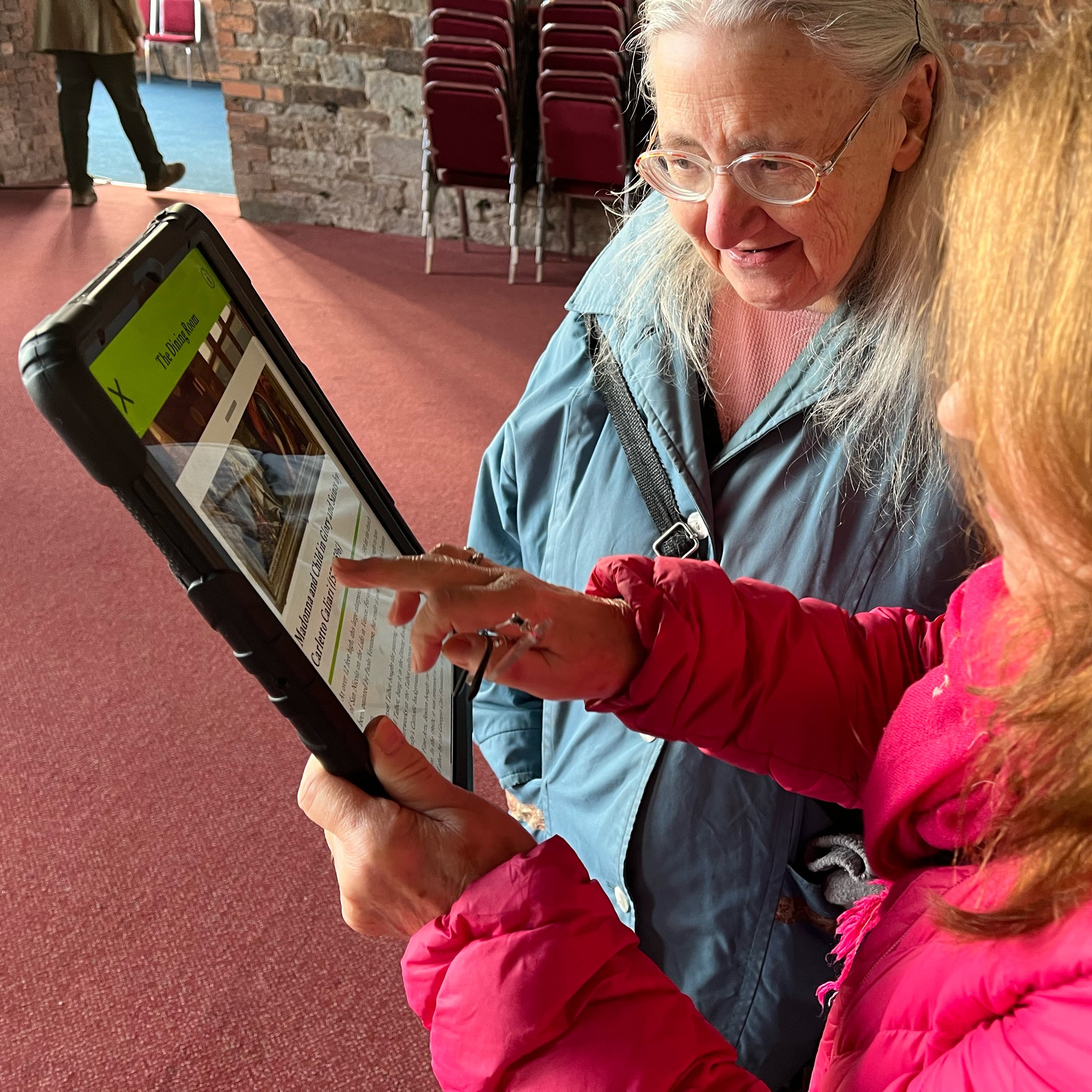 Two Margam Castle visitors using M[AR]gam app