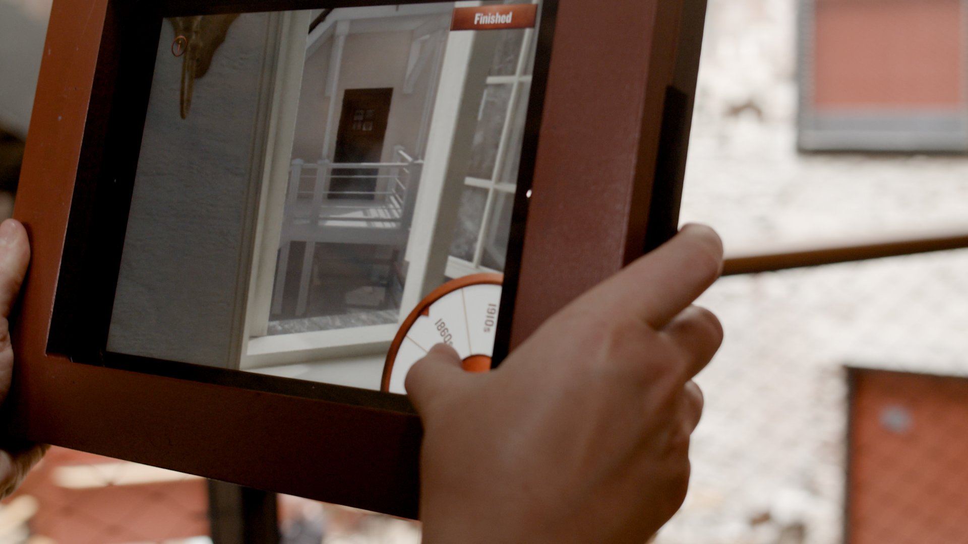 Person holding ipad using the Window to the Past Augmented Reality (AR) app made for Bristol Old Vic theatre