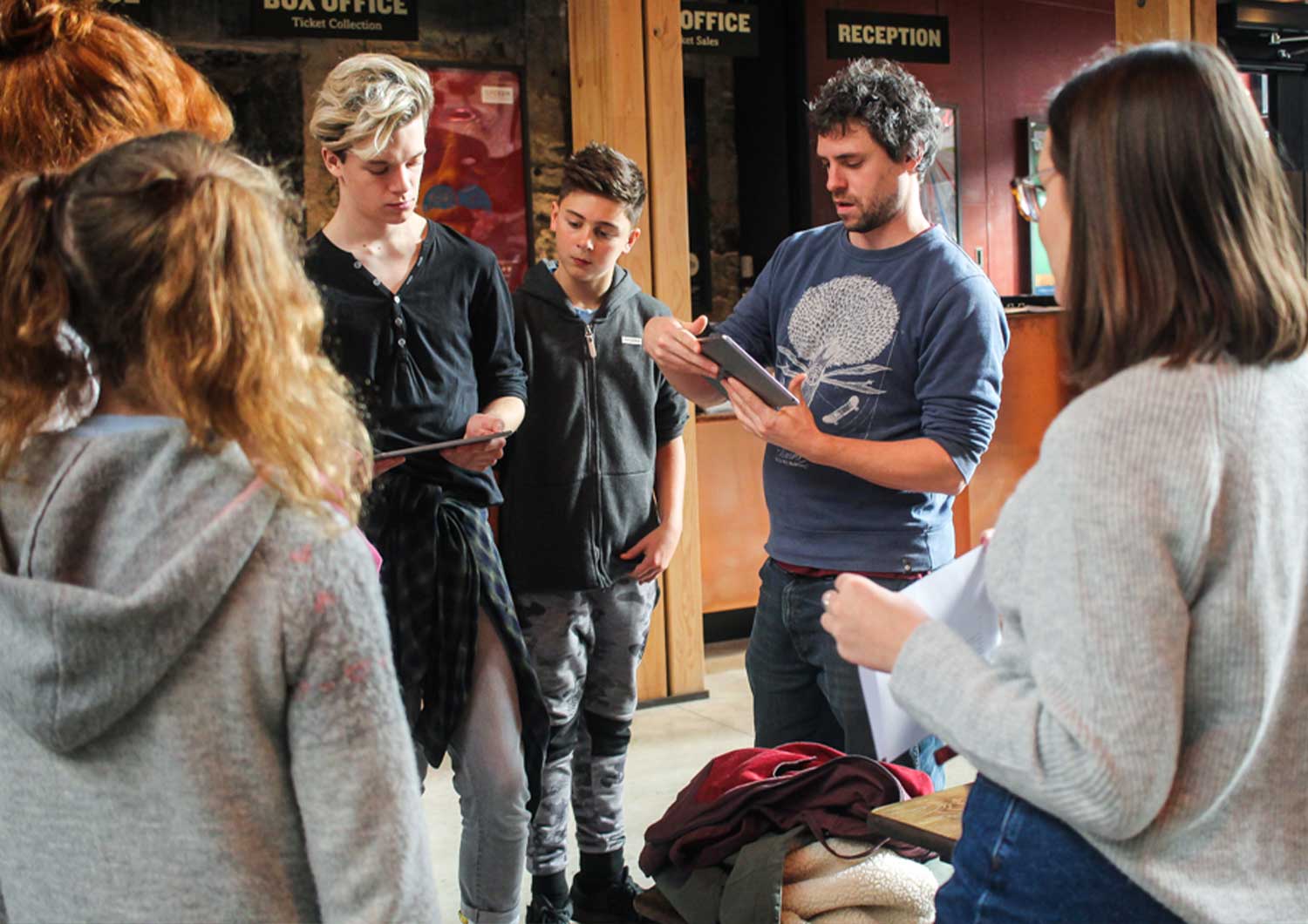 Group of people trying the Window to the past Augmented reality app for Bristol Old Vic