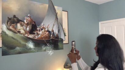 Woman using Benaki Museum AR app, augmented reality, interactive artefacts, accessible museums during pandemic isolation.