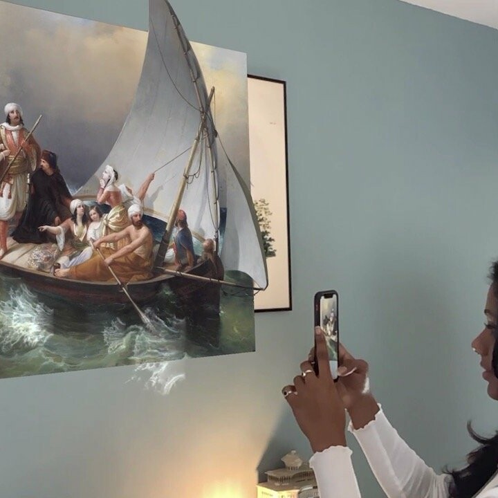 Woman using Benaki Museum AR app, augmented reality, interactive artefacts, accessible museums during pandemic isolation.