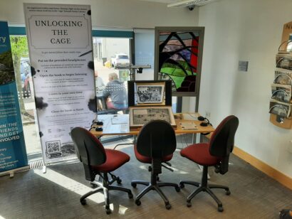 Library with the Unlocking the Cage AR book