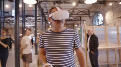 Man with VR (virtual reality) headset in the launch event of Bill's Attic VR and dome experience in memory of the artist Bill Mitchell