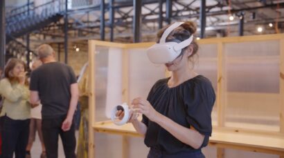 Woman with VR (virtual reality) headset in the launch event of Bill's Attic VR and dome experience in memory of the artist Bill Mitchell