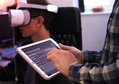 Person holding ipad controlling panel for Limina immersive VR cinema experience of the Bristol suspension bridge, for encounters film festival, immersive virtual reality cinema