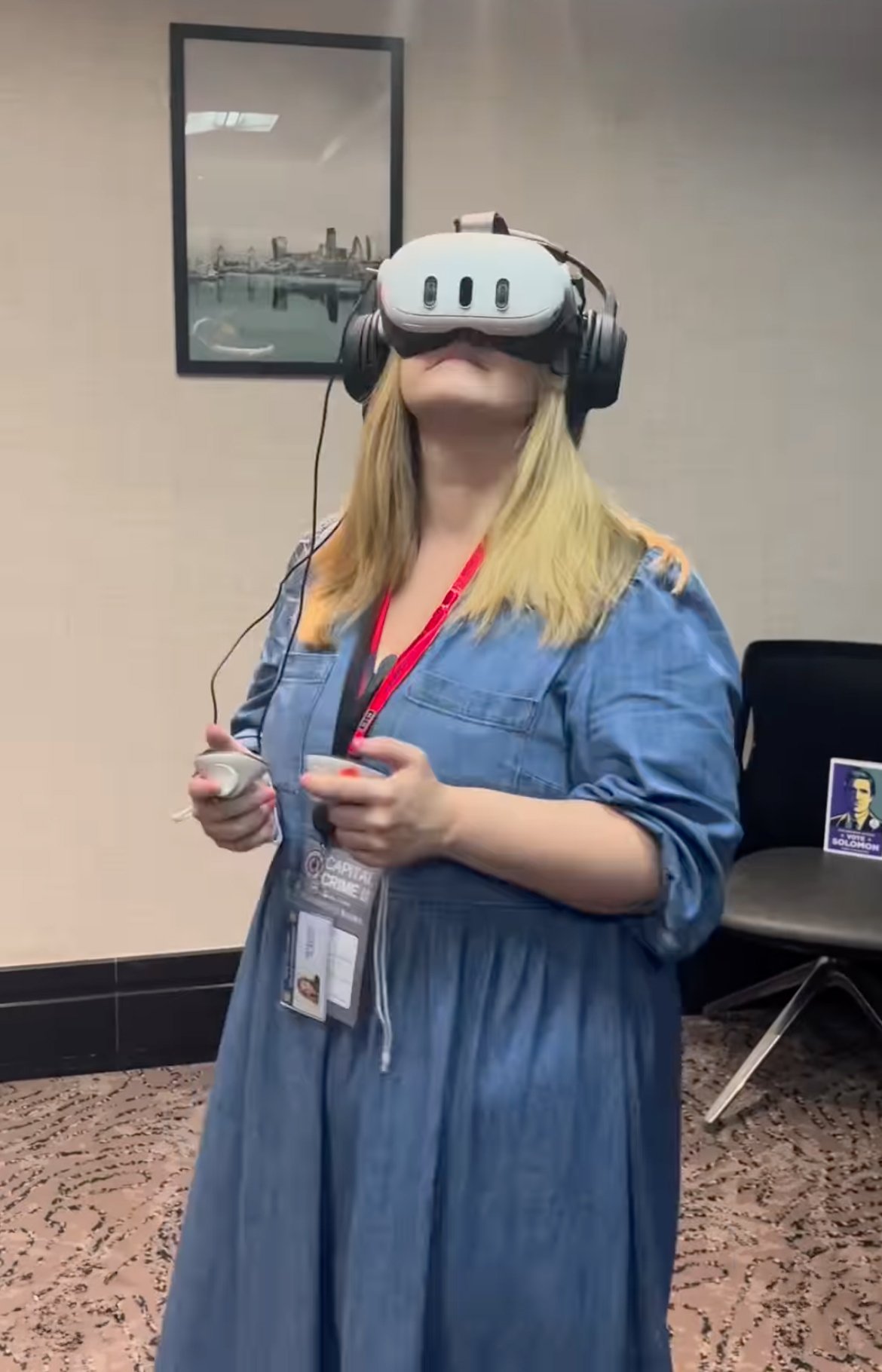 person with VR headset at book launch event