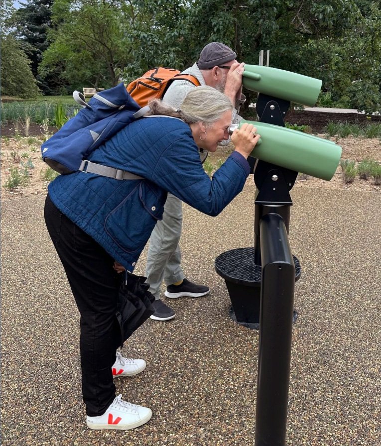 People looking through Virtual reality binoculars at Kew Gardens