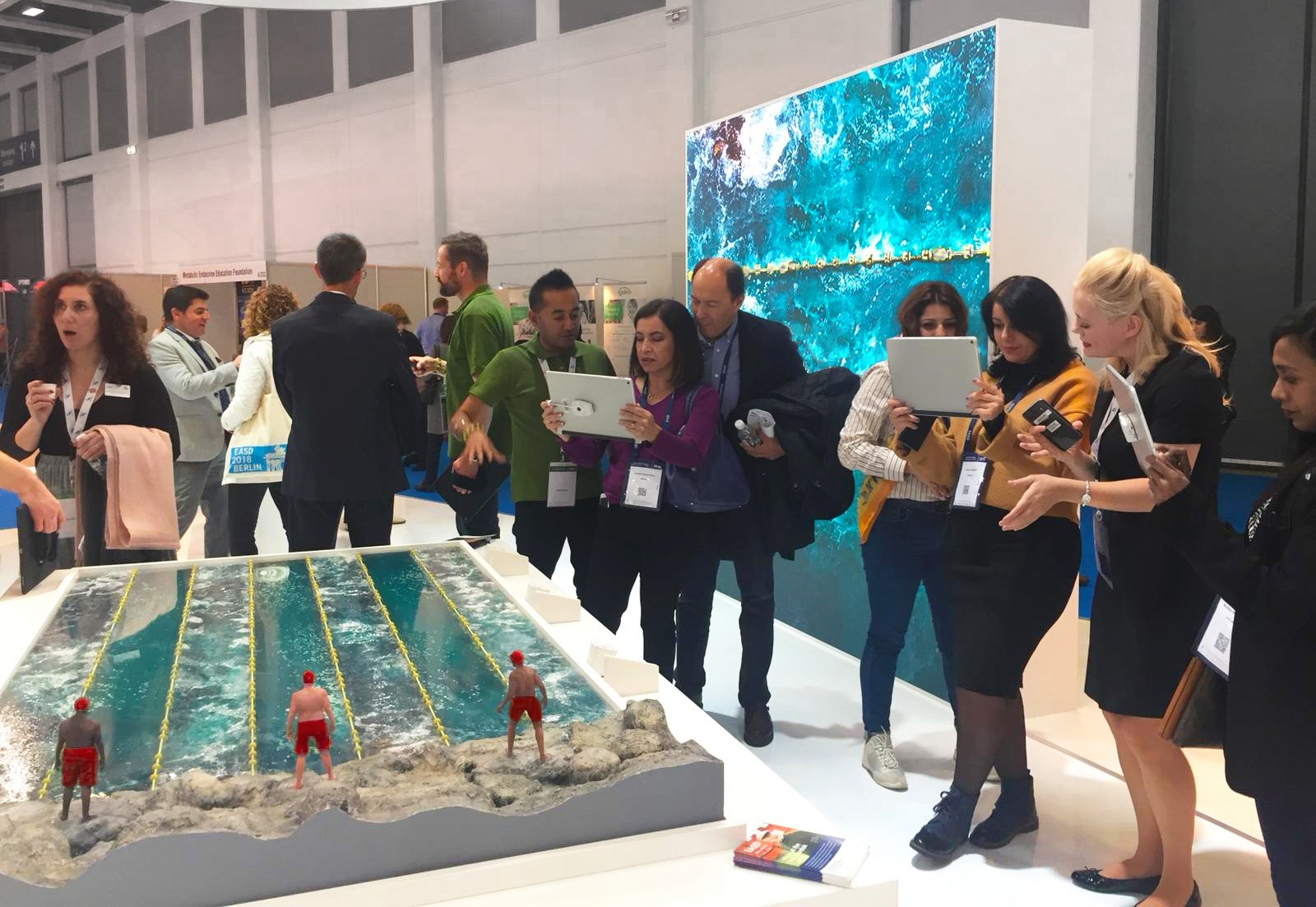 Marketing show. Augmented reality app in swimming pool model. AR medical showcase installation