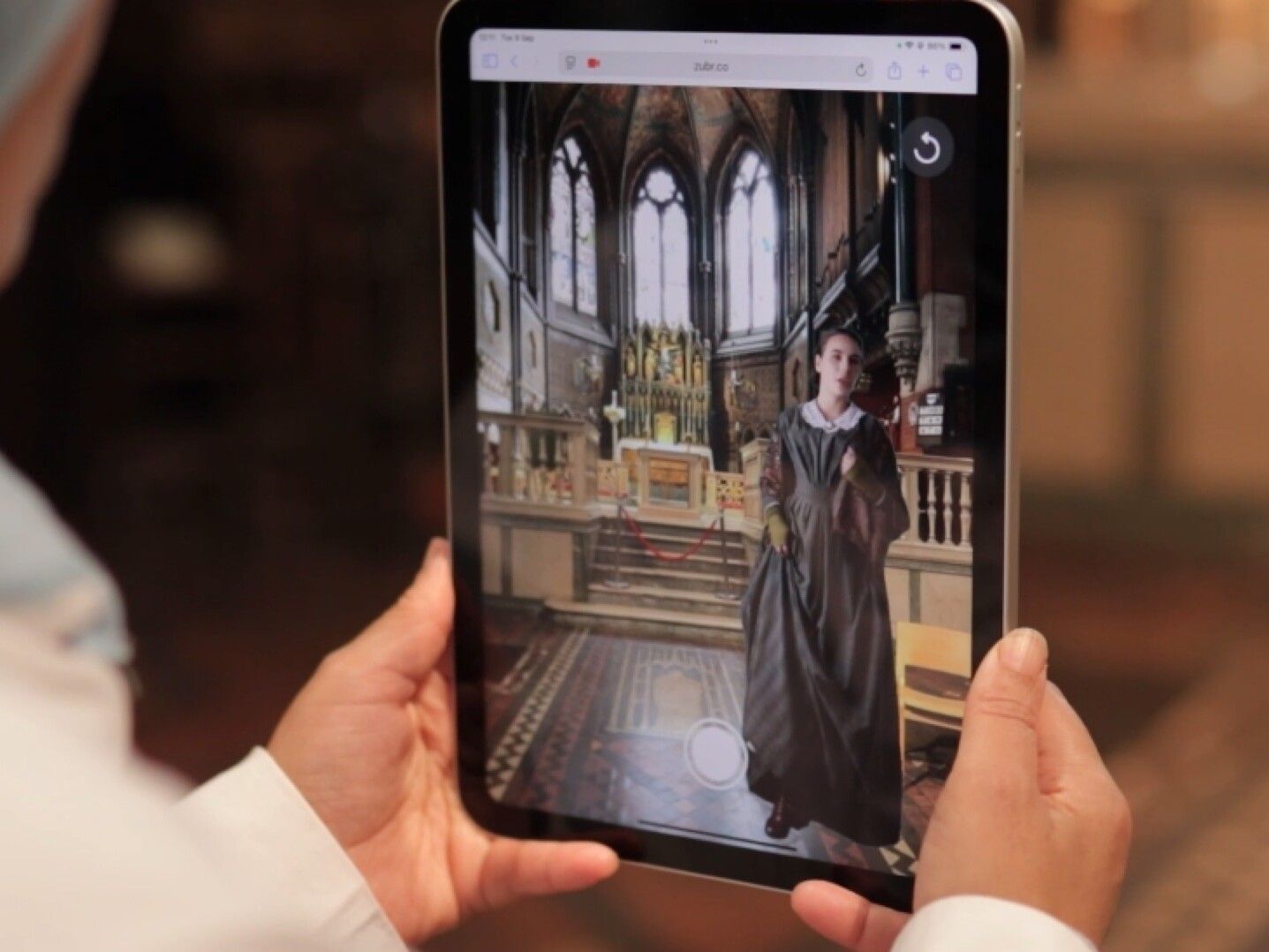Tablet with Augmented reality (AR) Victorian character in Digital Guide Grand Junction website