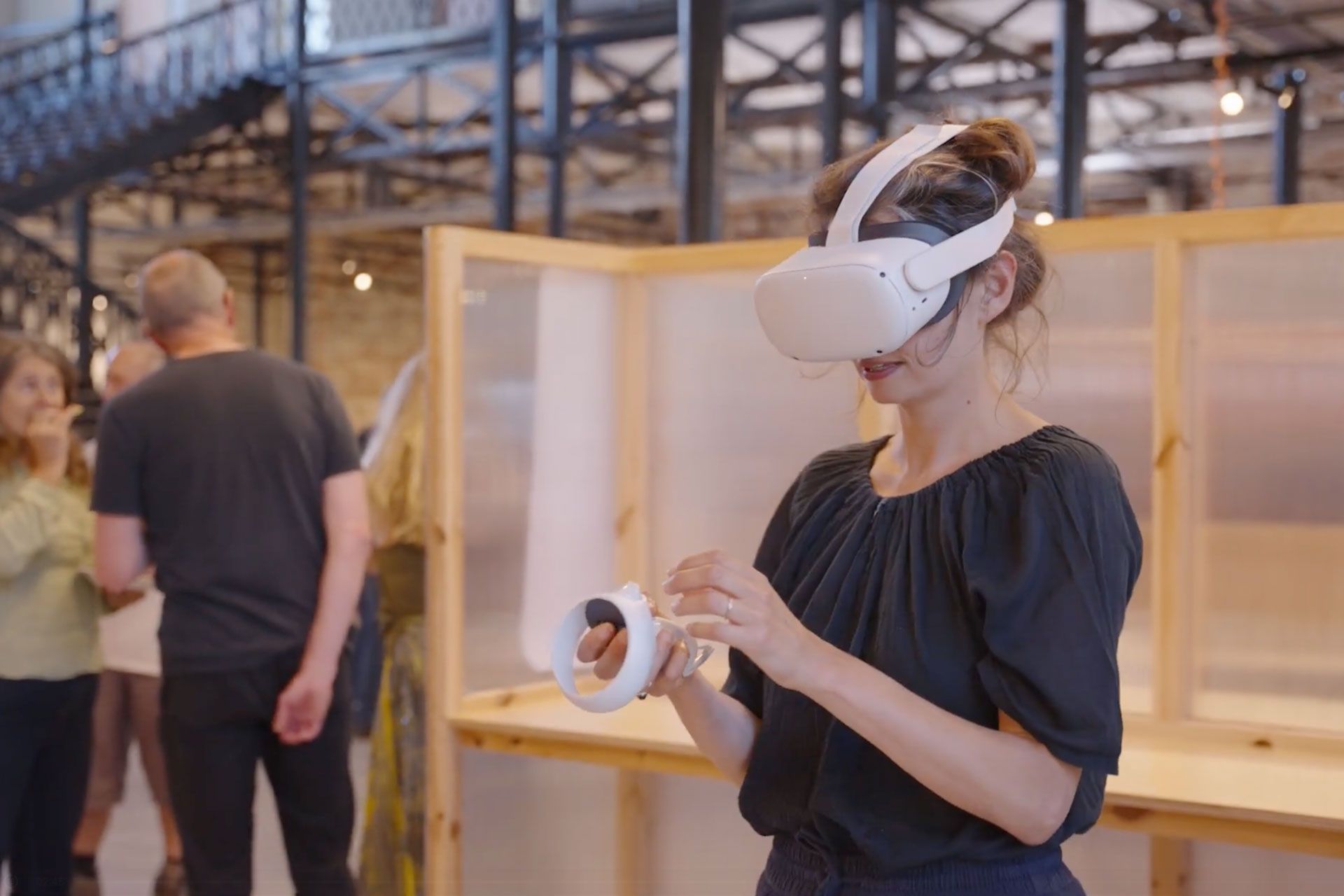 Woman with a VR headset on the Bills attic launch event