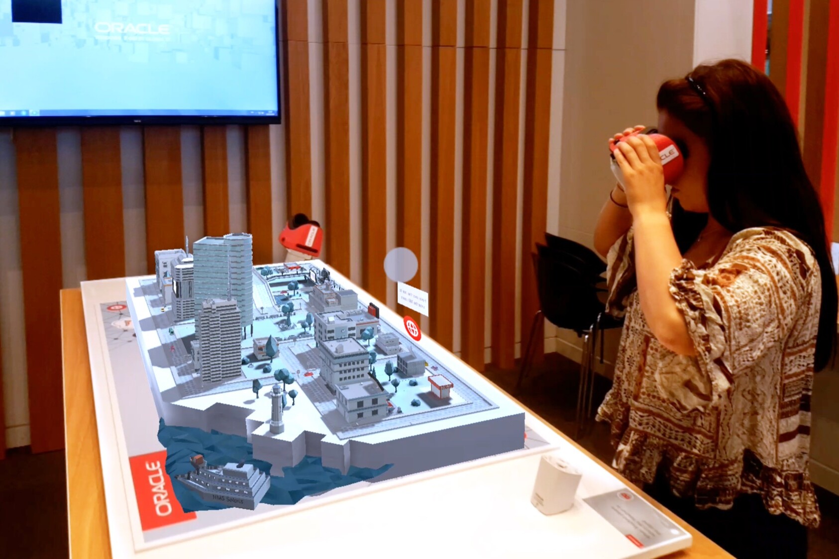 Woman using AR goggles to see Augmented Reality city